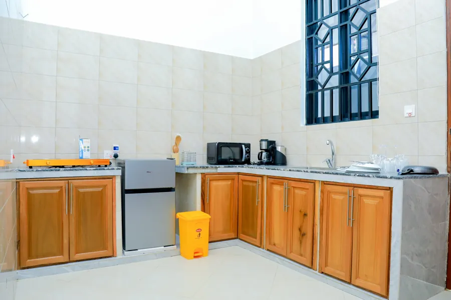 Kitchenette with fridge and cabinets